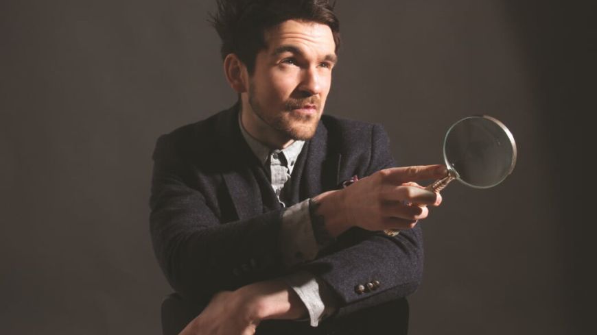 Colin Cloud with magnifying glass