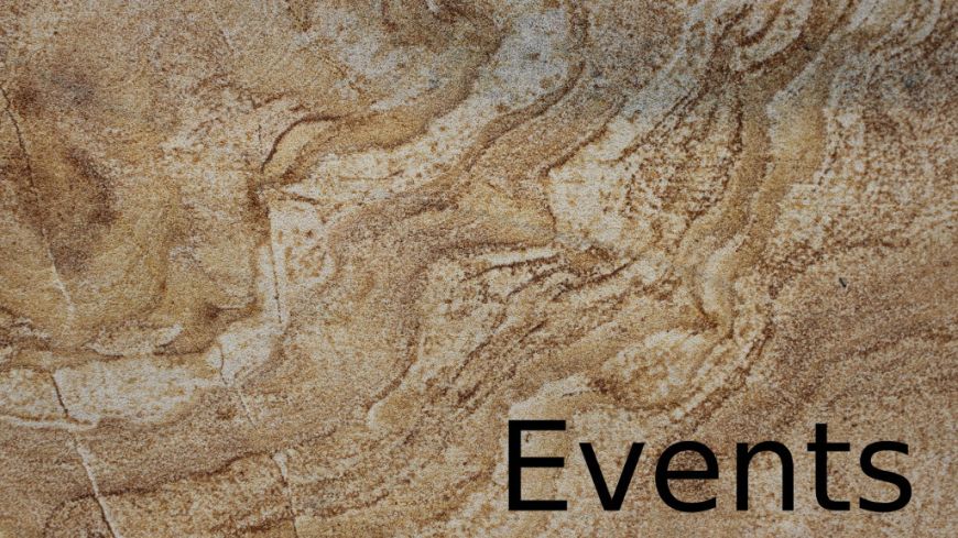 Holding image: "Events" on sandstone wall