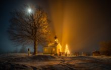 View of church in the snow and night