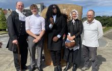 The cast of Darwin in Edinburgh pose outside Dynamic Earth