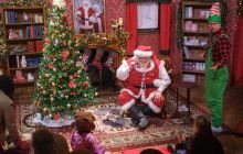 Santa and an elf at Santa's Stories, part of Edinburgh's Christmas