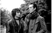 Withnail and I black and white of Richard E Grant and Paul McGann giving each other suspicious looks