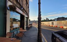 Looking past Hot Toddy  Bar and Café to Martys of Reform needle