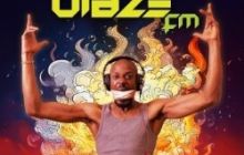 DJ from the show stands with arms up in the air, the words Blaze FM at the top, surrounded by fire.