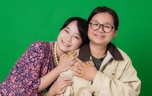 Cathy Lam and Kasen Tsui are pictured hugging, smiling for the camera.