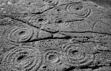 Black and white photograph of prehistoric rock art