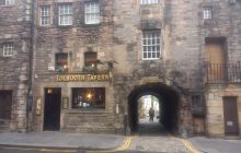 The Tolbooth Tavern on the historic Royal Mile during Royal Week with flag flying outside
