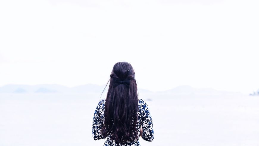 Woman in front of landscape