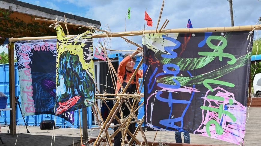 Artist Sarah Kenchington hangs sails at Bridge 8 Hub