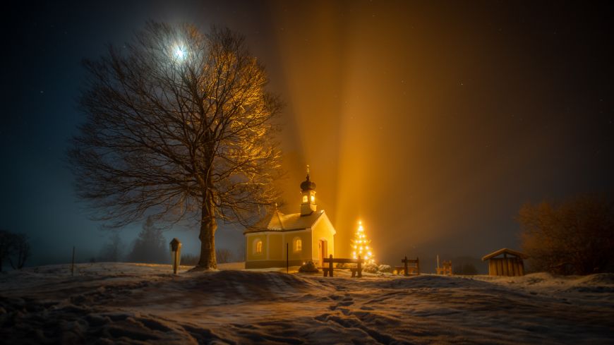 View of church in the snow and night