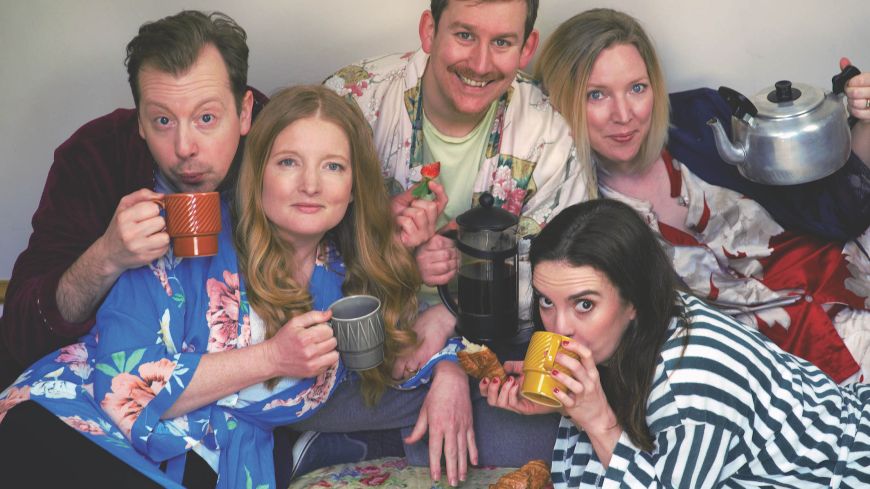 The five cast members of Bite-Sized plays pose with cups of tea