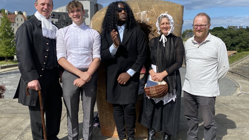 The cast of Darwin in Edinburgh pose outside Dynamic Earth