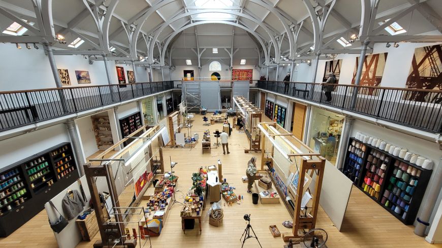 Weavers at work at the Dovecot Studios Gallery in Edinburgh, a former swimming pool
