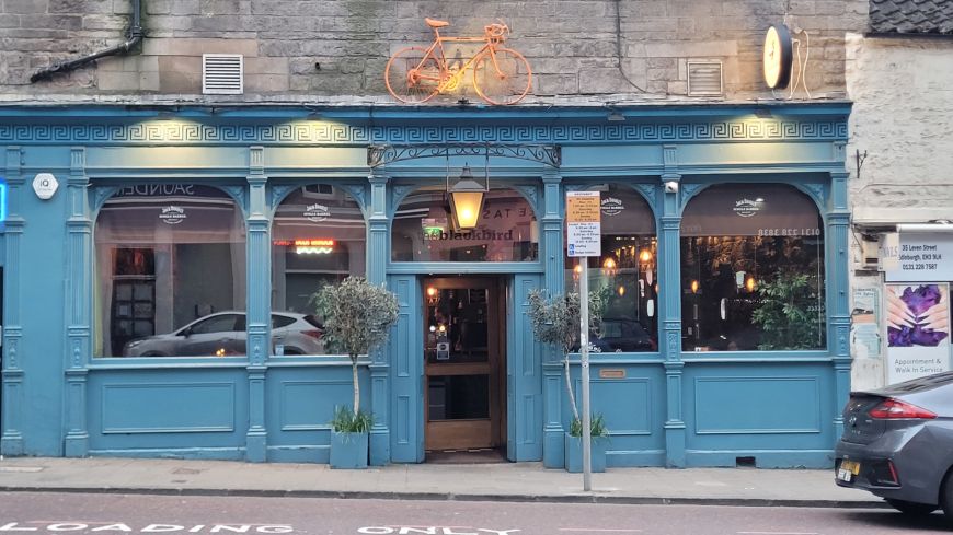 Blackbird Cafe's sky blue front in the evening