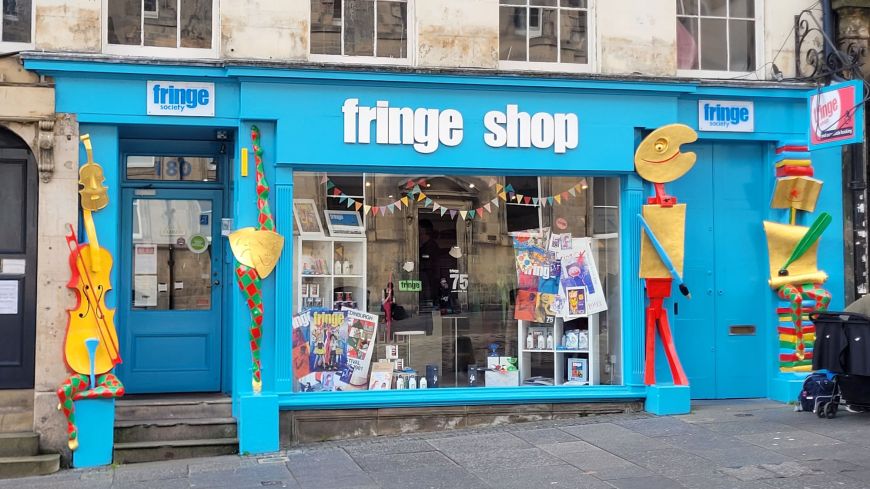 Turquoise front of the Edinburgh Fringe Shop on the Royal Mile