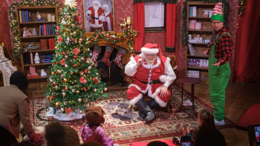 Santa and an elf at Santa's Stories, part of Edinburgh's Christmas