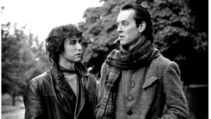 Withnail and I black and white of Richard E Grant and Paul McGann giving each other suspicious looks