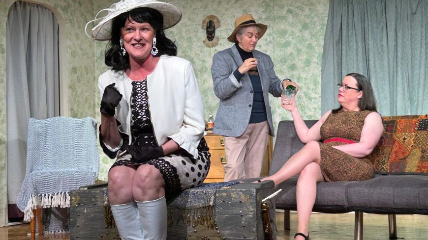 Three of the cast members of The Rats are posed, mid-scene, one to the fore with the other two at the back