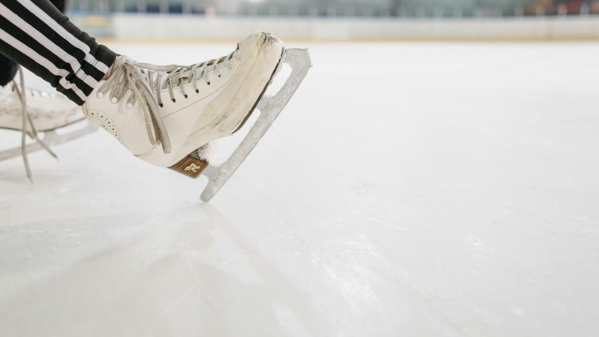 An ice skate on a sports rink