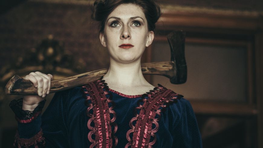 Sasha Wilson as Llizzie Borden, dressed in period costume