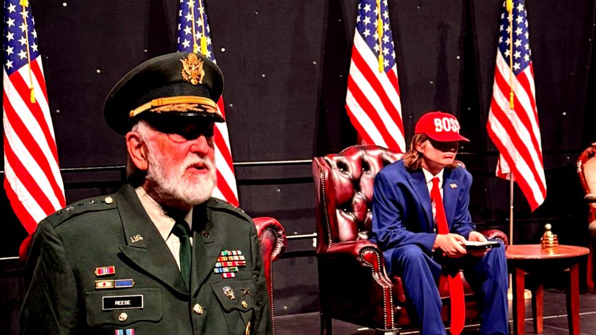 The General stands on the left, Trump is in the middle and several American flags surround the space.
