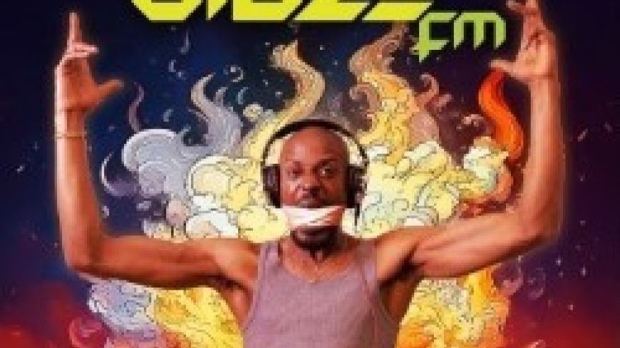 DJ from the show stands with arms up in the air, the words Blaze FM at the top, surrounded by fire.
