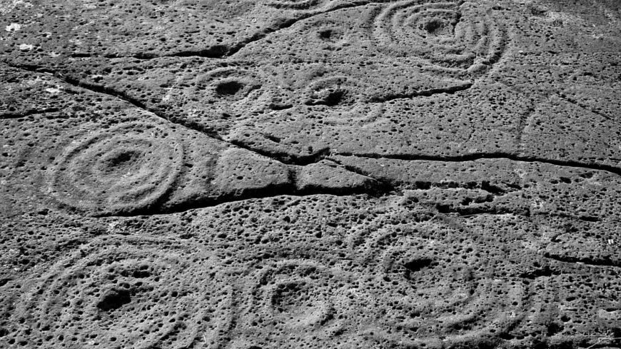 Black and white photograph of prehistoric rock art