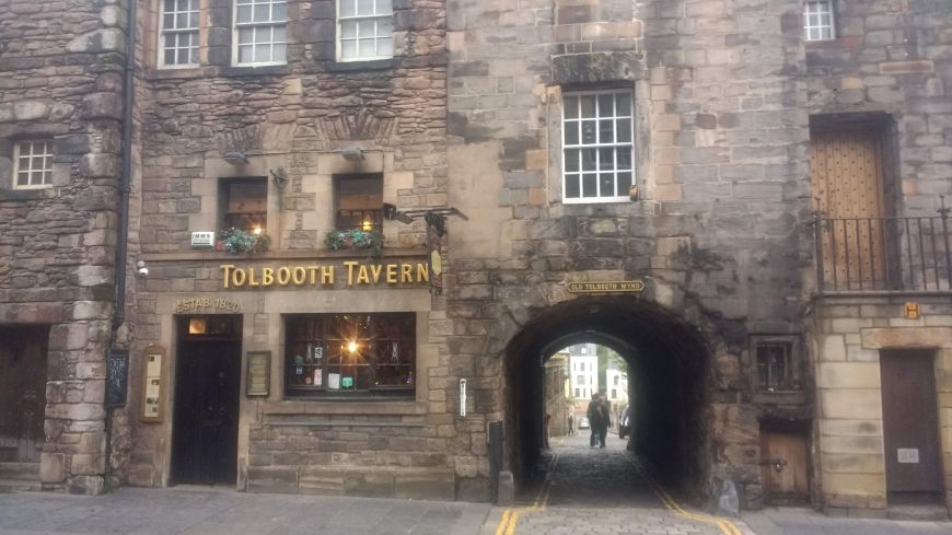 The Tolbooth Tavern on the historic Royal Mile during Royal Week with flag flying outside