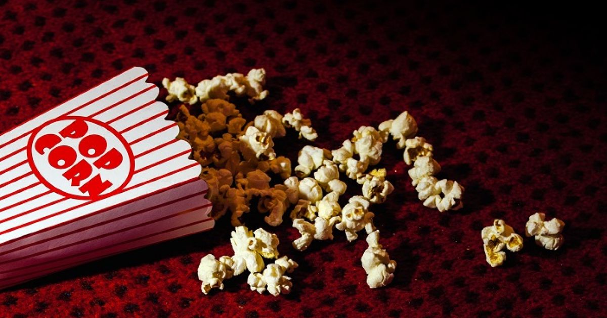Screen 9 text, on a dark red background, with popcorn scattered around.