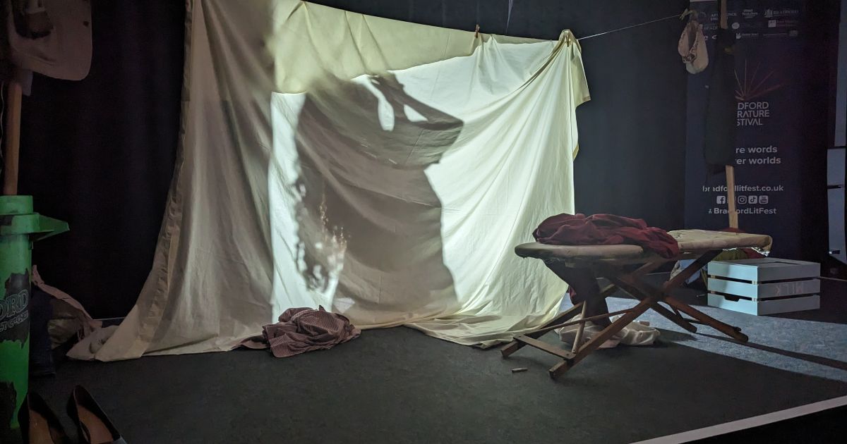 Screen made from a sheet; actor washes behind the screen while still talking.