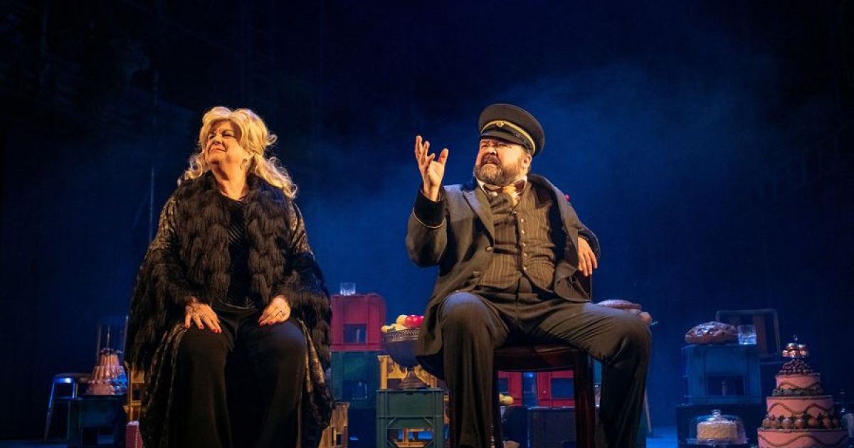 L-R: Sitting, gazing at the world are Elaine C Smith as Mrs Puntila and Steven McNicoll as Matti.